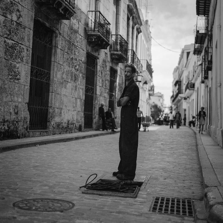 Street Workman, Old Havana, Cuba - Silver Gelatin Photograph: Title: Street Workman, Old Havana, Cuba - Silver Gelatin Photograph Dimensions: 20 x 20 in Medium: Street Workman, Old Havana, Cuba - Silver Gelatin Photograph - Limited Edition of 10 Paul Cooklin Uni