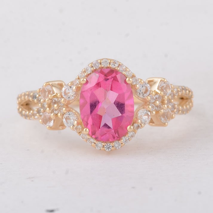 2.18 Ct Oval Pink Topaz 9K Gold Ring: 2.18 Total Carat Pink Topaz 9K Gold Ring Specifications: Total Weight 2.31 g Center Gemstone Pink Topaz Gemstone Carat Weight 1.67 Carats Gemstone Measurements 8X6 mm Additional Gemstones White