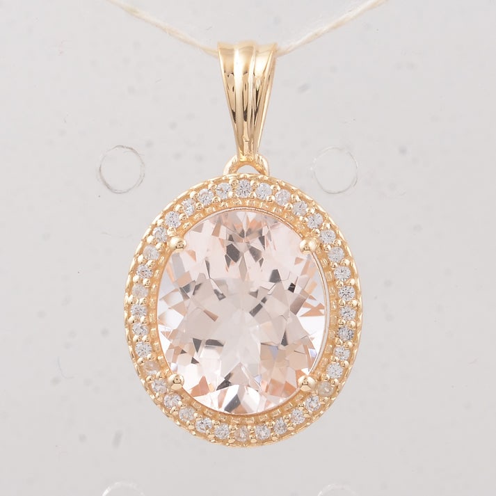3.31 Ct Oval Morganite 9K Gold Pendant: 3.31 Total Carat Morganite 9K Gold Pendant Specifications: Total Weight 1.93 g Center Gemstone Morganite Gemstone Carat Weight 3.15 Carats Gemstone Measurements 11X9X5.50 mm Additional Gemstones White