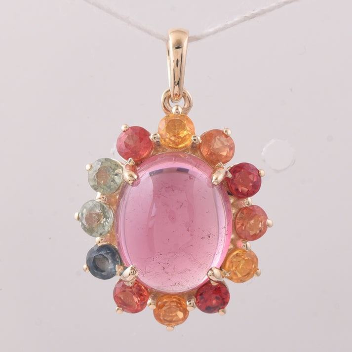 5.62 Ct Oval Tourmaline 9K Gold Pendant: 5.62 Total Carat Tourmaline 9K Gold Pendant Specifications: Total Weight 2.216 g Center Gemstone Tourmaline Gemstone Carat Weight 4.07 Carats Gemstone Measurements 11X9X5.10 mm Additional Gemstones