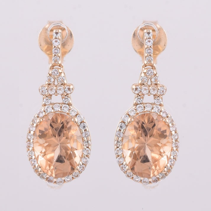 2.69 Ct Oval Tourmaline 9K Gold Earrings: 2.69 Total Carat Tourmaline 9K Gold Earrings Specifications: Total Weight 2.006 g Center Gemstone Tourmaline Gemstone Carat Weight 2.36 Carats Gemstone Measurements 8X6 mm Additional Gemstones White S