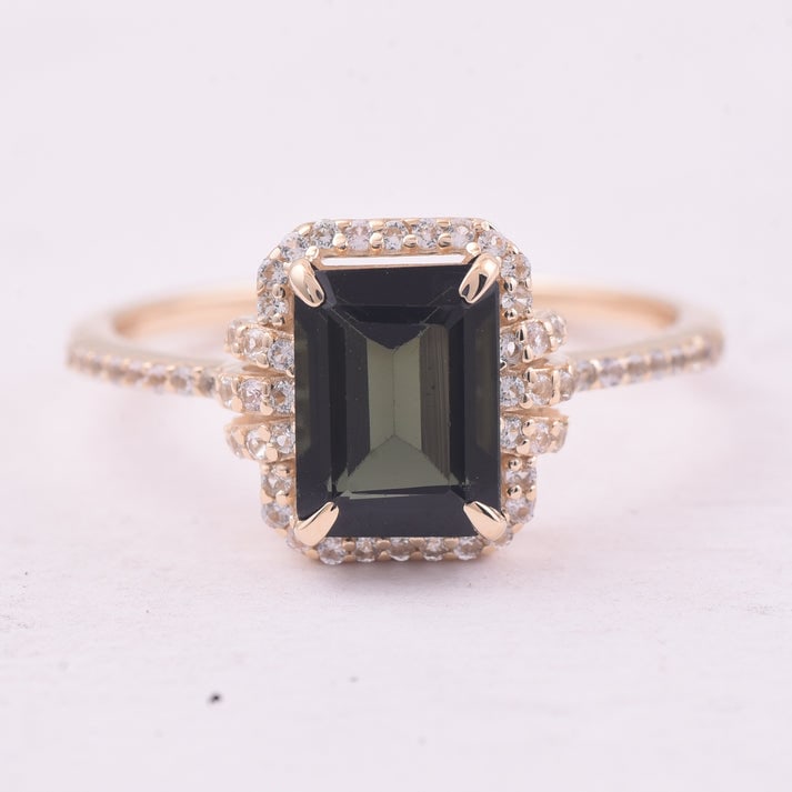 1.71 Ct Octagon Tourmaline 9K Gold Ring: 1.71 Total Carat Tourmaline 9K Gold Ring Specifications: Total Weight 1.919 g Center Gemstone Tourmaline Gemstone Carat Weight 1.42 Carats Gemstone Measurements 8X6 mm Additional Gemstones White Sapph