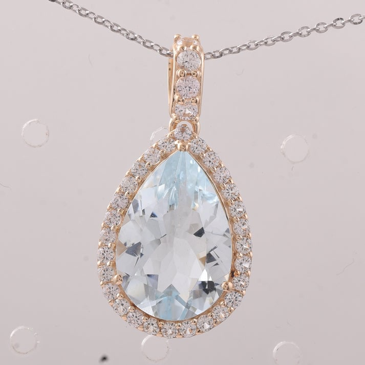 5.49 Ct Pear Aquamarine 9K Gold Pendant: 5.49 Total Carat Aquamarine 9K Gold Pendant Specifications: Total Weight 2.209 g Center Gemstone Aquamarine Gemstone Carat Weight 4.8 Carats Gemstone Measurements 15.10X10.20X6 mm Additional Gemstones