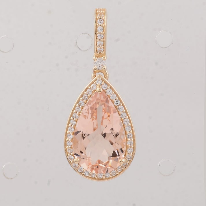 2.81 Ct Pear Morganite 9K Gold Pendant: 2.81 Total Carat Morganite 9K Gold Pendant Specifications: Total Weight 1.87 g Center Gemstone Morganite Gemstone Carat Weight 2.61 Carats Gemstone Measurements 12X8X4.90 mm Additional Gemstones White