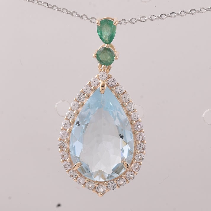 4.59 Ct Pear Aquamarine 9K Gold Pendant: 4.59 Total Carat Aquamarine 9K Gold Pendant Specifications: Total Weight 2.034 g Center Gemstone Aquamarine Gemstone Carat Weight 3.81 Carats Gemstone Measurements 15.20X10X4.90 mm Additional Gemstone
