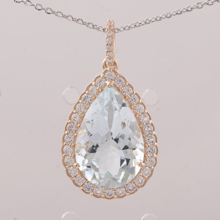 5.47 Ct Pear Aquamarine 9K Gold Pendant: 5.47 Total Carat Aquamarine 9K Gold Pendant Specifications: Total Weight 2.219 g Center Gemstone Aquamarine Gemstone Carat Weight 4.92 Carats Gemstone Measurements 14.90X10X6.60 mm Additional Gemstone