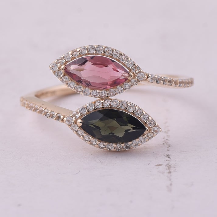 1.13 Ct Marquise Tourmaline 9K Gold Ring: 1.13 Total Carat Tourmaline 9K Gold Ring Specifications: Total Weight 1.754 g Center Gemstone Tourmaline Gemstone Carat Weight 0.84 Carats Gemstone Measurements 8X4 mm Additional Gemstones White Sapph