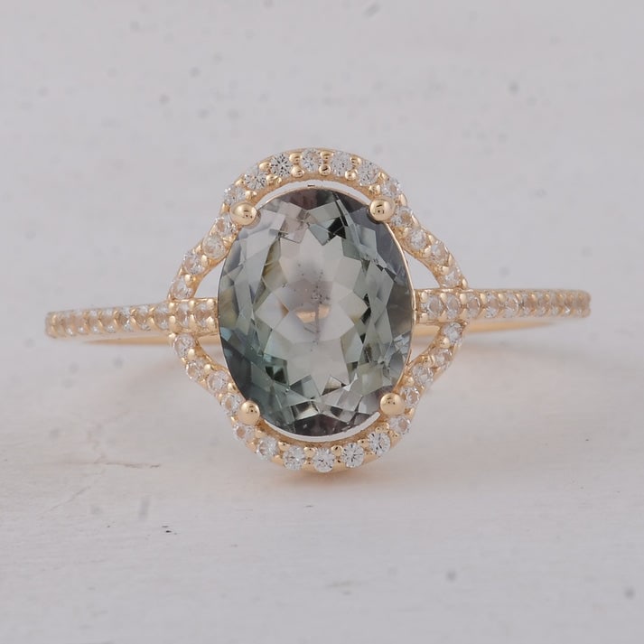 2.12 Ct Oval Multi Tourmaline 9K Gold Ring: 2.12 Total Carat Multi Tourmaline 9K Gold Ring Specifications: Total Weight 2.17 g Center Gemstone Multi Tourmaline Gemstone Carat Weight 1.9 Carats Gemstone Measurements 9X7 mm Additional Gemstones W