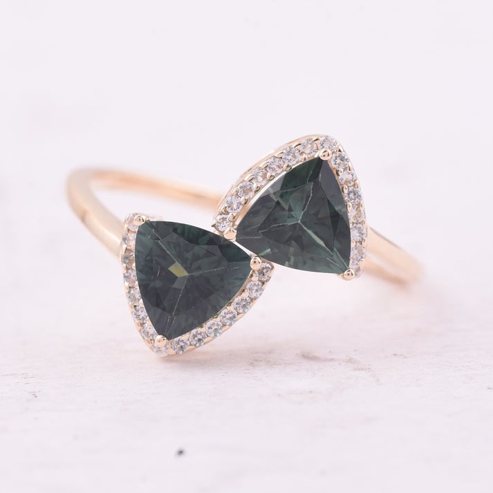 1.55 Ct Trillion Tourmaline 9K Gold Ring: 1.55 Total Carat Tourmaline 9K Gold Ring Specifications: Total Weight 1.818 g Center Gemstone Tourmaline Gemstone Carat Weight 1.42 Carats Gemstone Measurements 6X6 mm Additional Gemstones White