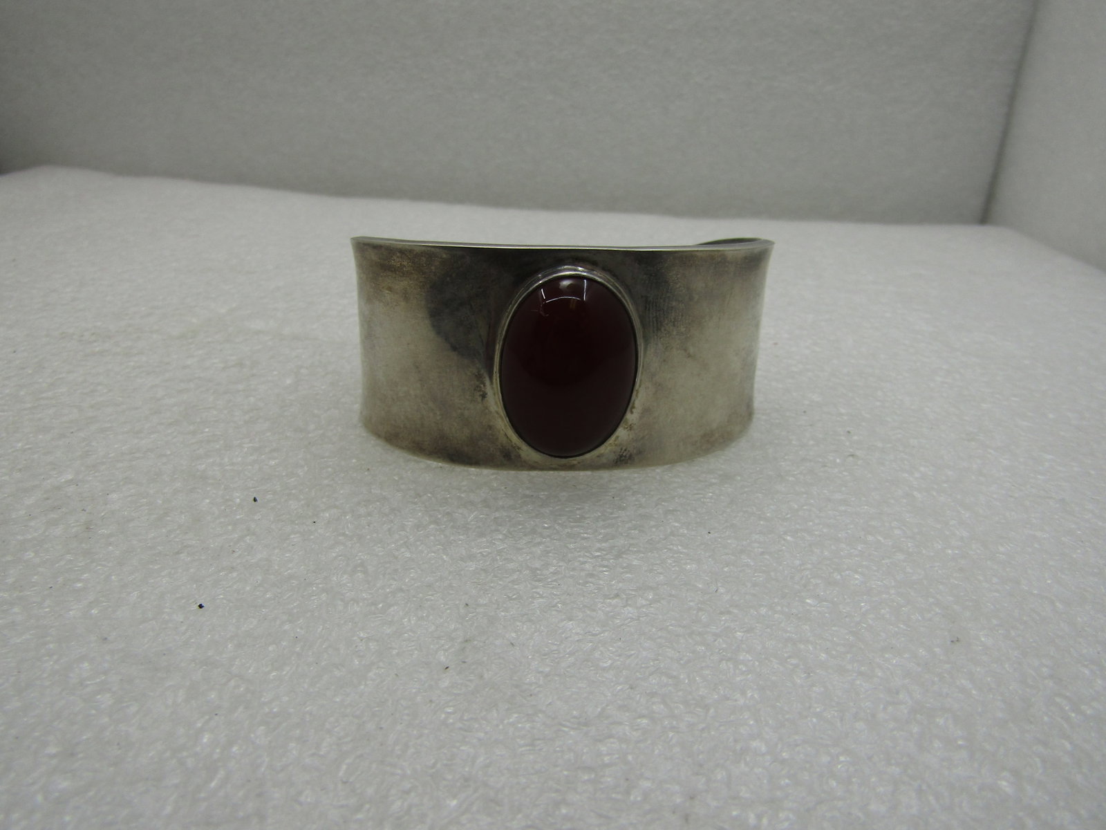 Sterling Silver Red Carnelian Cuff Bracelet, Mexico signed CII (Mexico City).: Sterling Silver Red Carnelian Cuff Bracelet, Mexico signed CII (Mexico City). Weight is appx. 29 grams. The inner circumference of the bracelet is about 6 3/4?. It measures about 2 1/2" by 1 3/4" and 