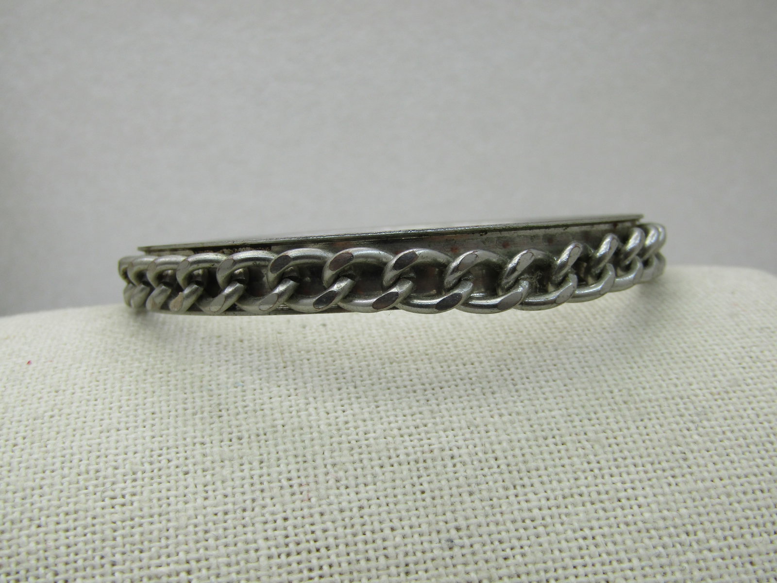 Vintage Curb Link Bangle Bracelet, 8.5", Silver Tone: Vintage Curb Link Bangle Bracelet, 8.5", Silver Tone, 8.5mm wide. 1980's-1990's. Silver tone recessed bangle bracelet with a curb link chain set in the recessed area. Opening is 2.75" and allows for m