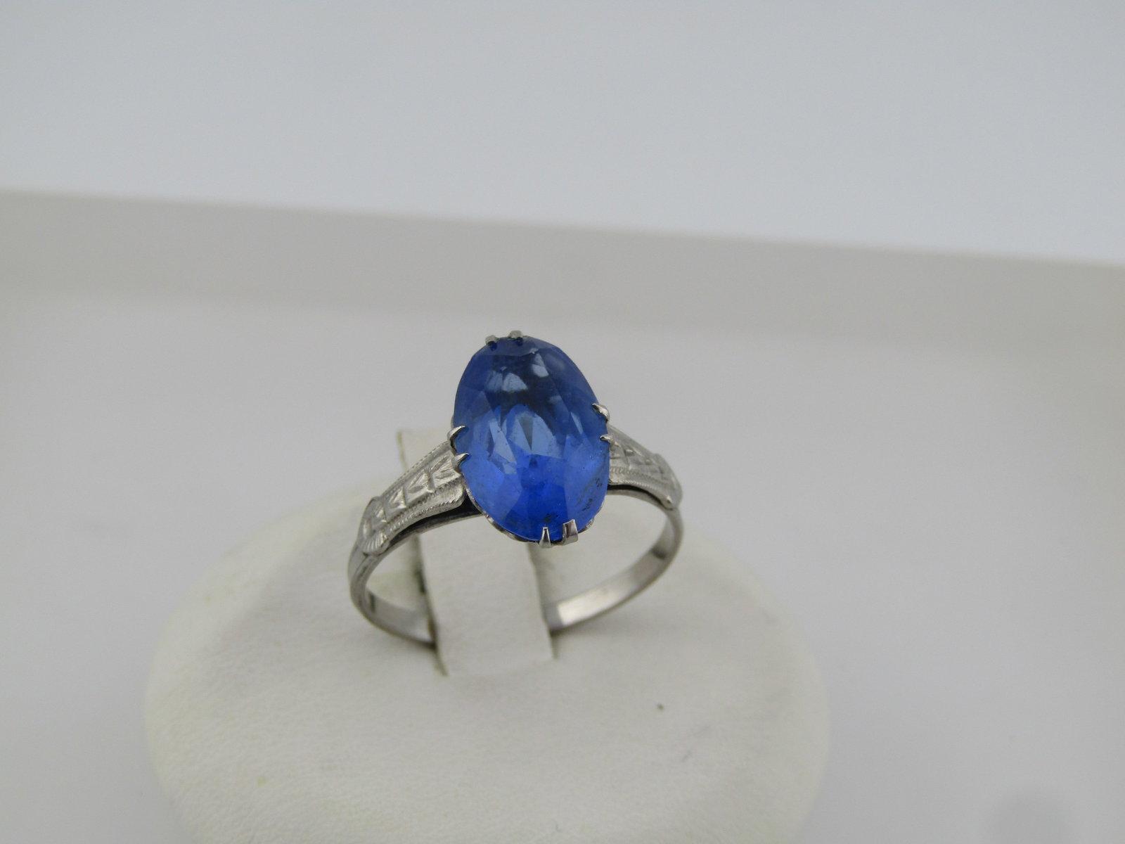 Vintage Art Deco Costume Blue Stone Ring, Sz. 7.5, Signed SPM, 1920's-1940's: Vintage Art Deco Costume Blue Stone Ring, Sz. 7.5, Signed SPM, 1940's. This has a blue glass stone that is appx. 13mm long and down the finger and 8mm across the finger with an art deco stamped design