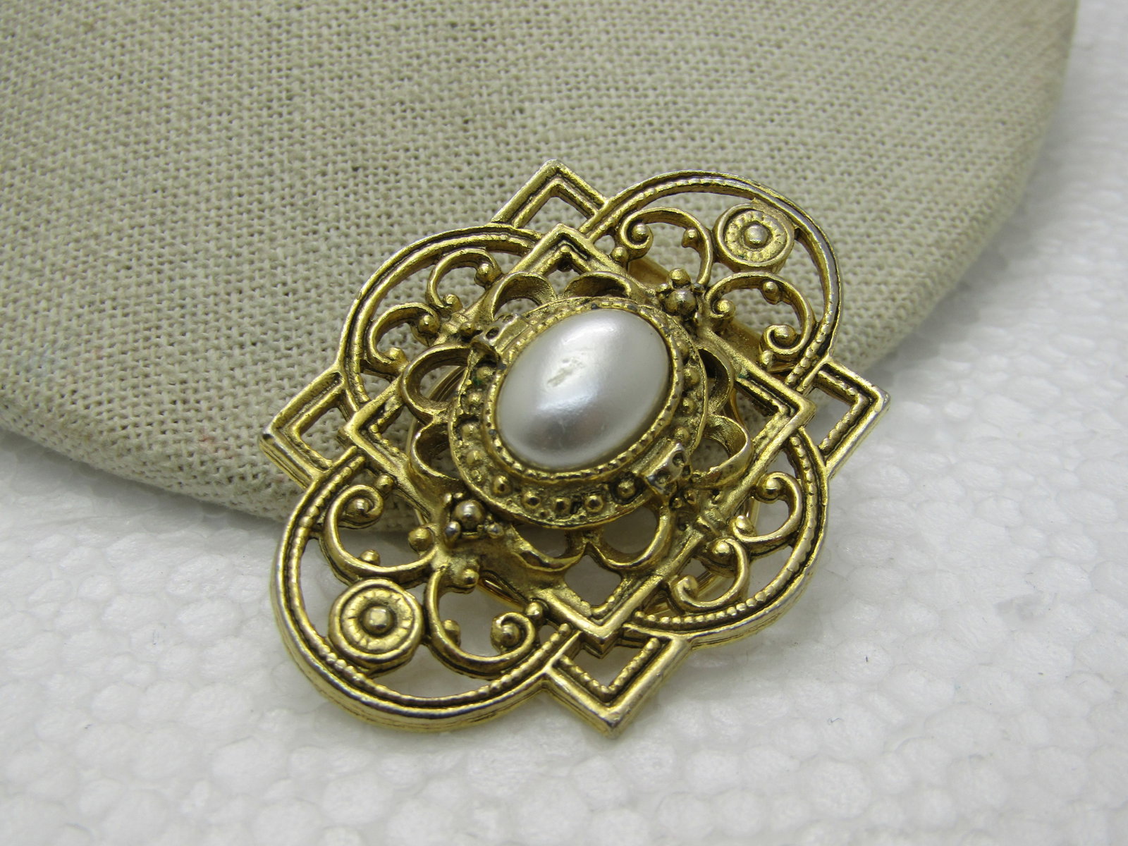 Vintage Victorian Themed Faux Pearl Scarf Clip, 2", Gold Tone: Vintage Victorian Themed Faux Pearl Scarf Clip, 2" by 1.5", Scrolled open frame. Gold Tone. Tiered design. 1980's. Not signed by maker. Very good condition. (INV. W.22020.6 SS 1396 LMV LD 5/23/20) Res