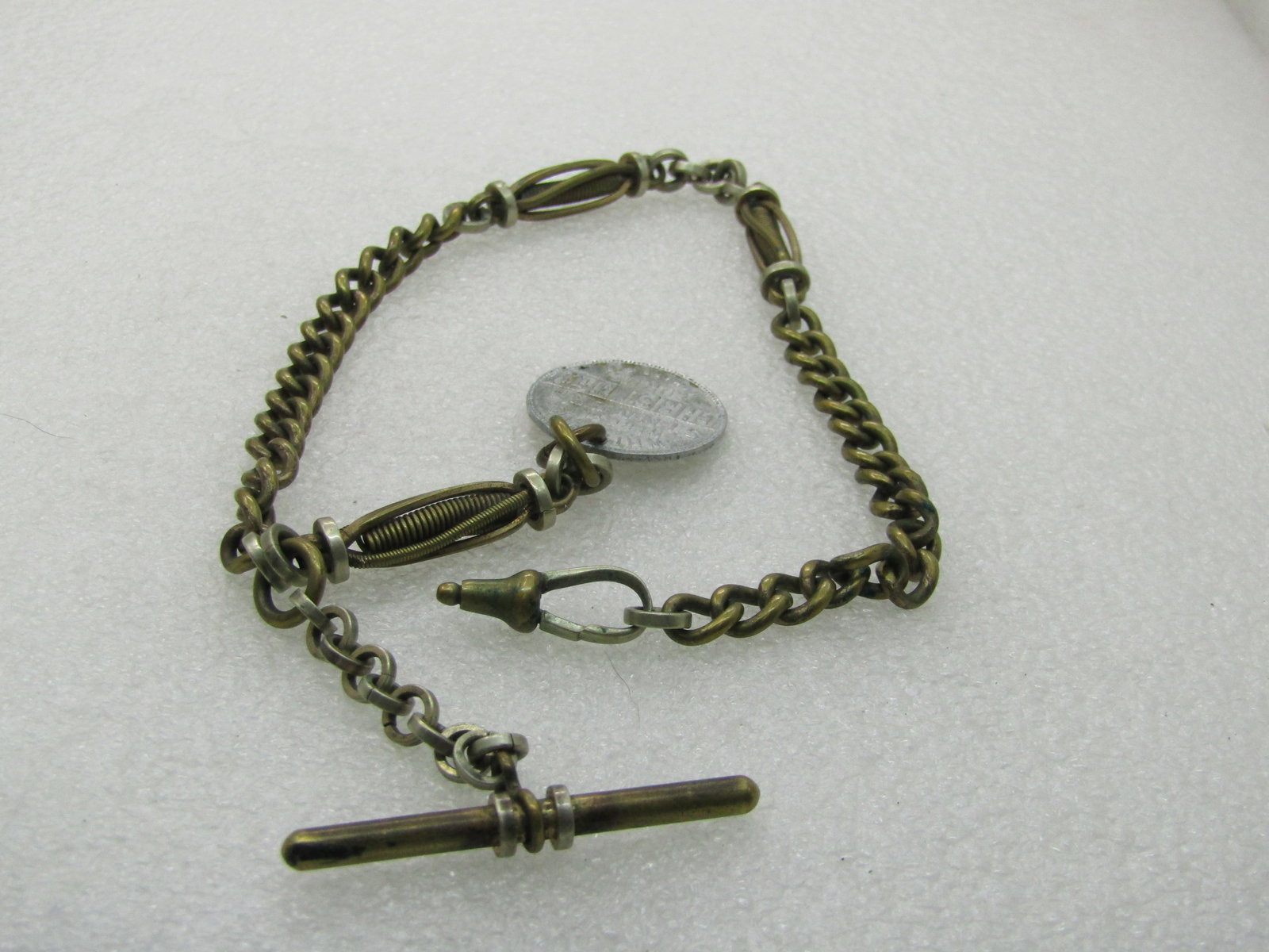 Vintage Early 1900's Heavy Watch Chain with Newer Fob: Vintage Early 1900's Heavy Watch Chain with Newer Fob, 13" with a 1" aluminum While we Were Sinners Coin-like fob that can be removed to have a more period fob added. The chain is a heavy brass that