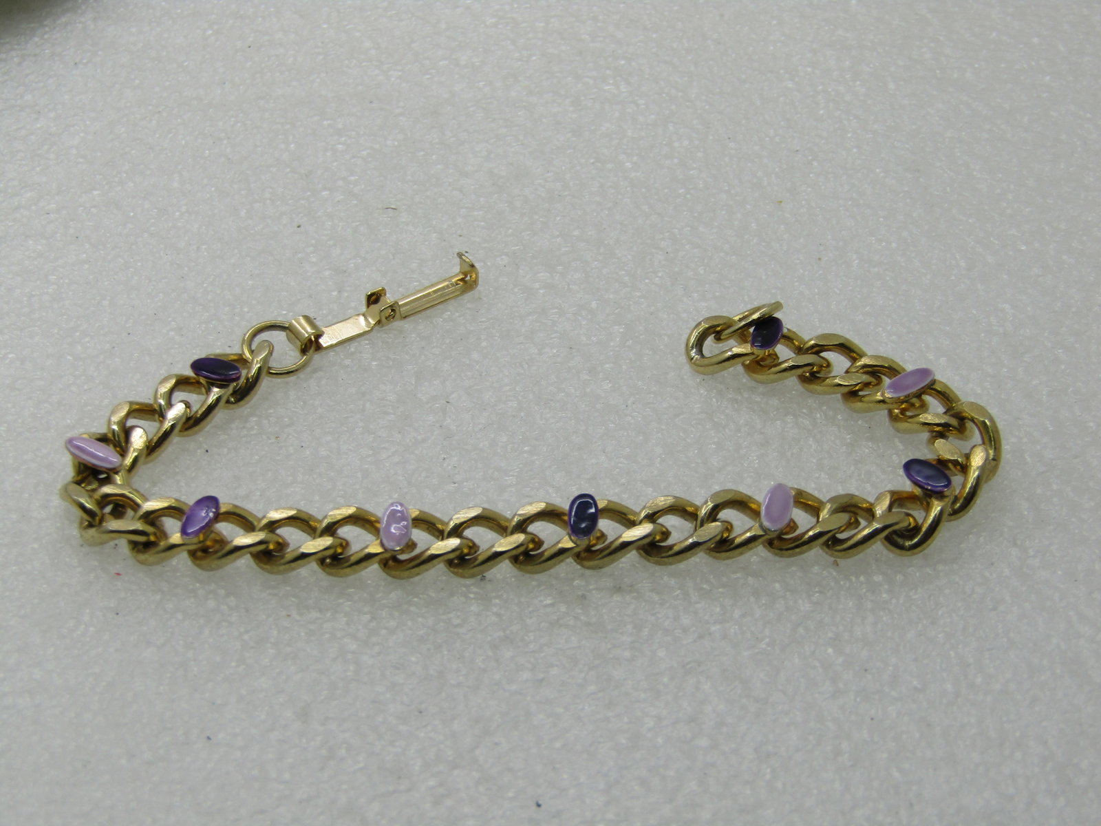Vintage Curb Link Bracelet Purple/Lavender Enameled Accents, 7.25", 6.5mm: Vintage Curb Link Bracelet Purple/Lavender Enameled Accents, 7.25", 6.5mm, gold tone. Flipover clasp. Not signed, Very good condition, 1980's-1990's. (INV. W.27-2015.6 SS2607 LEB LD 10/7/20) Reserve: