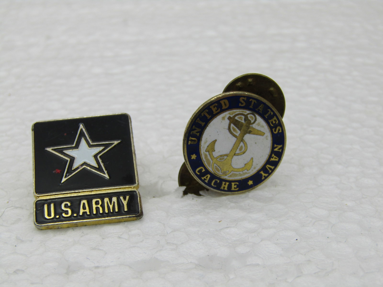 Vintage Enameled Army & Navy Tack/Lapel Pins: Vintage Enameled Army & Navy Tack/Lapel Pins. Rectangular Black and white enameled U.S. Army pin appx. 1" by 3/4". The navy is white enameled backgroundw ith a gold anchor and blue enameled frame with