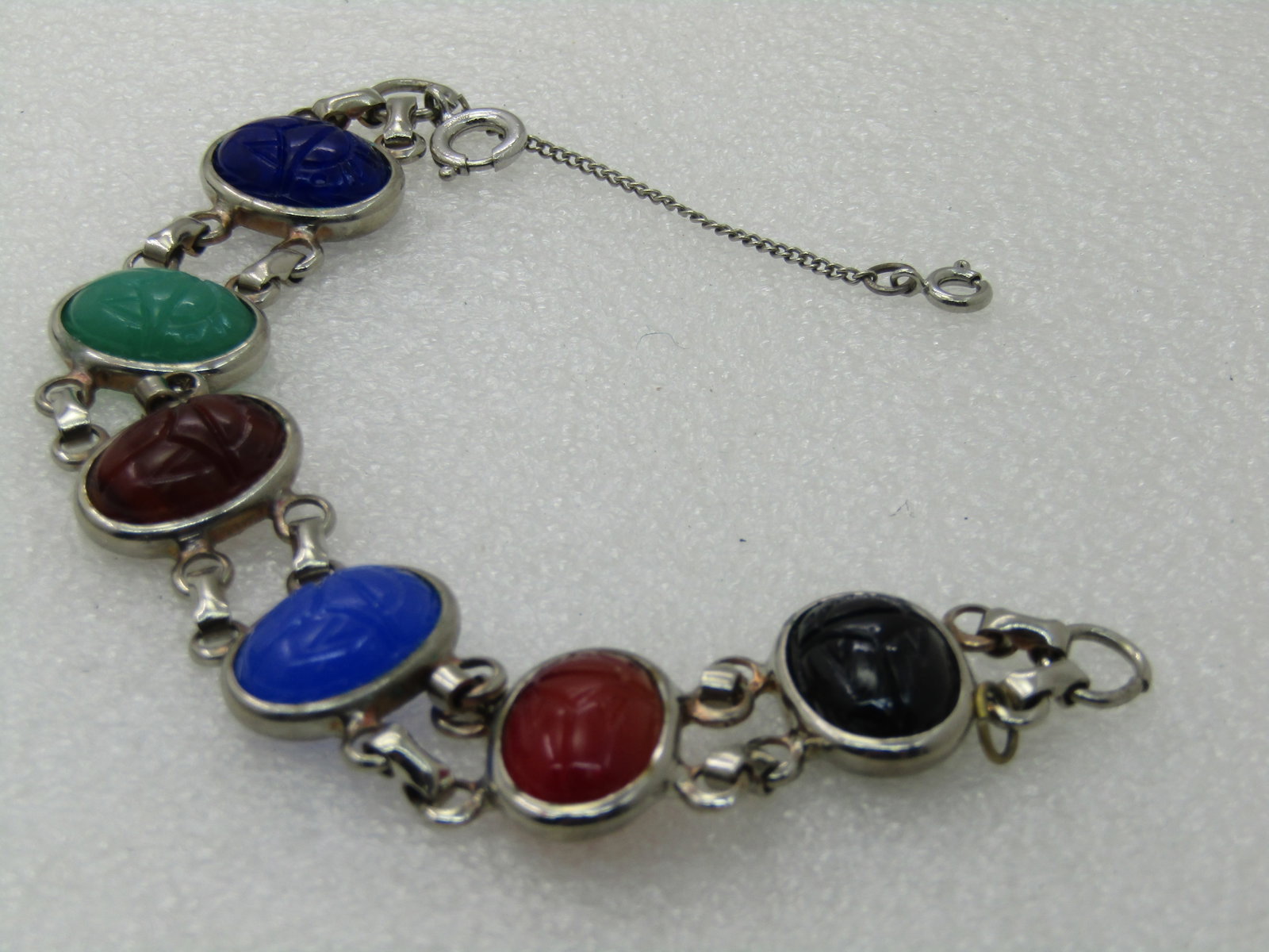 Vintage Egyptian Themed Scarab Bracelet, 7', Glass Scarabs, 1960's-1970's: Vintage Egyptian Themed Scarab Bracelet, 7', Glass Scarabs, 1960's-1970's 3/4" Bezel-set glass scarbas in b lue, green, rown, carnelian colored and black with a double strand of links connecting each 