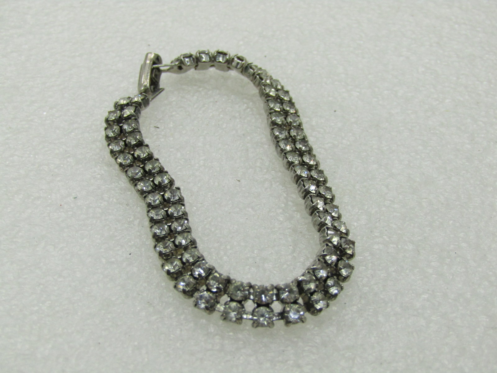 Vintage Art Deco Style Rhinestone Bracelet, Double Row, 7", 1960's: Vintage Art Deco Style Rhinestone Bracelet, Double Row, 7", 1960's. 6.6mm wide. Silver tone. Good to very good condition. Stones are clear. Not signed by the maker. (INV. W.27-30.15.1X1 SS2558 LD 9/28