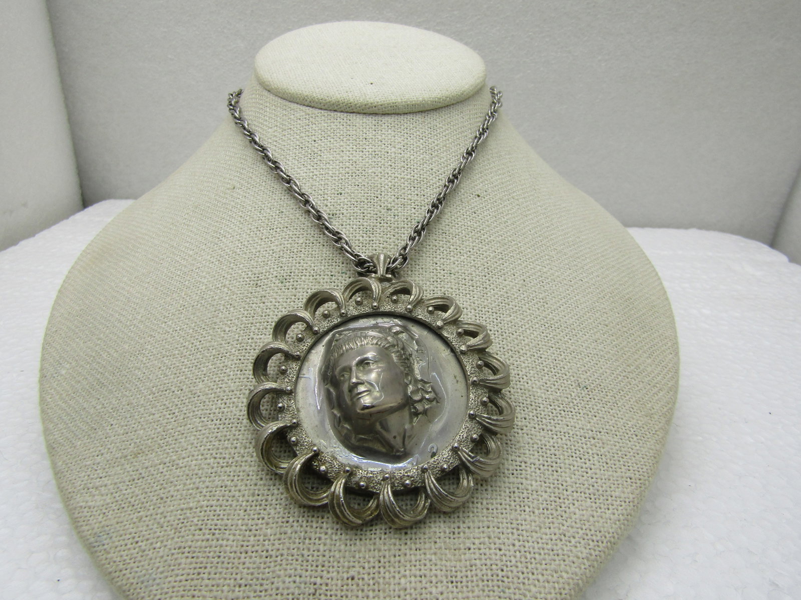 Vintage 1972 Pop-Out Repousse Dollar Coin Necklace, 22": Vintage 1972 Pop-Out Repousse Dollar Coin Necklace, 22". United States Dollar coin with a raised face of what is believed to be Lady Liberty which is a process that is almost like vacuumed sealing