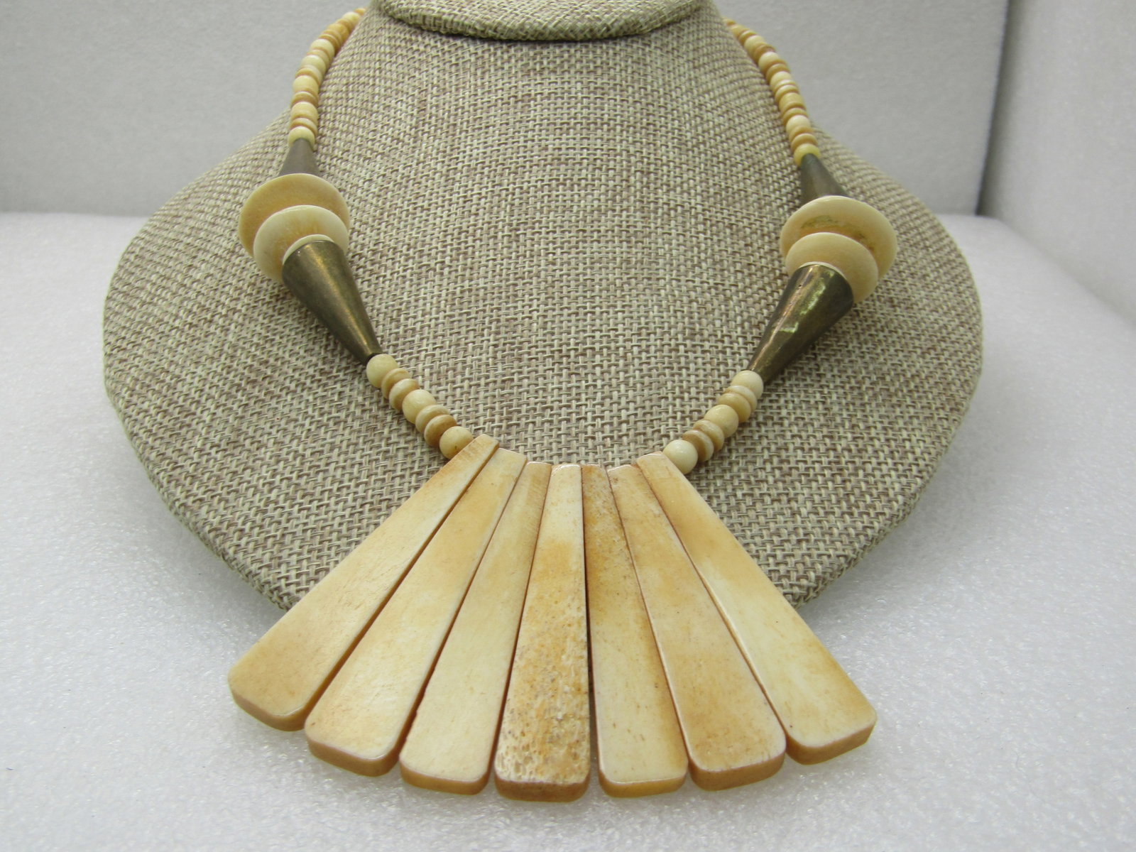 Vintage Tribal Brass & Bone Bib Necklace, 18.5", 1960's: Vintage Tribal Brass & Bone Bib Necklace, 18.5", 1960's, a drop of tapered 2.25" drops arranged in a fan drop with appx. 5mm round and disc beads and conical brss accents at the side with graduated ma