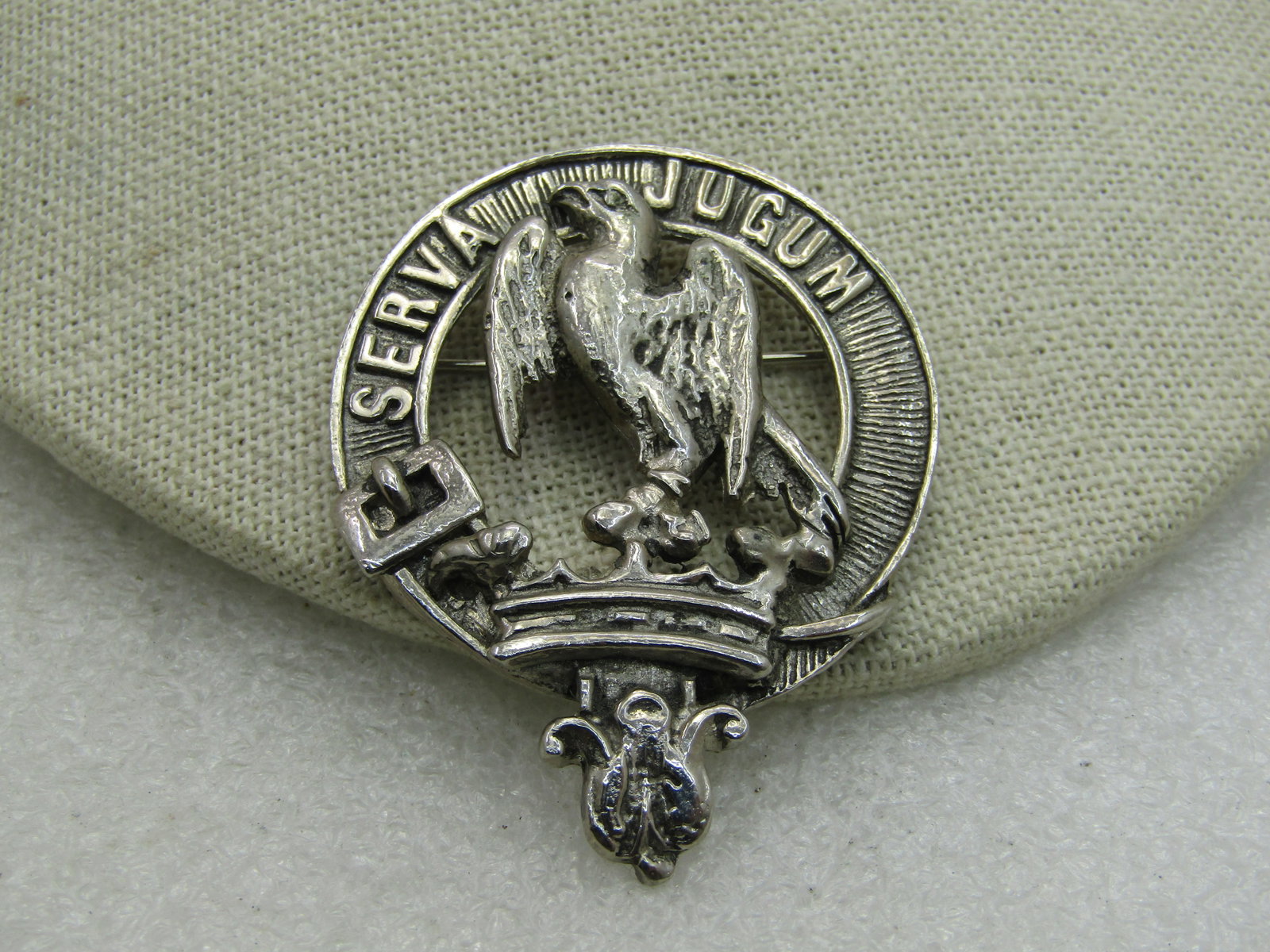 Vintage Scottish Serva Jugum Clan Brooch, Kilt Pin, "My Word": Vintage Scottish Serva Jugum Clan Brooch, Kilt Pin, "My Word" Hay Clan, 2" by 1-5/8", features a belt, crown in an open center pin, heavy silver tone metal. 1960's-1980's. Signed but cannot make out.