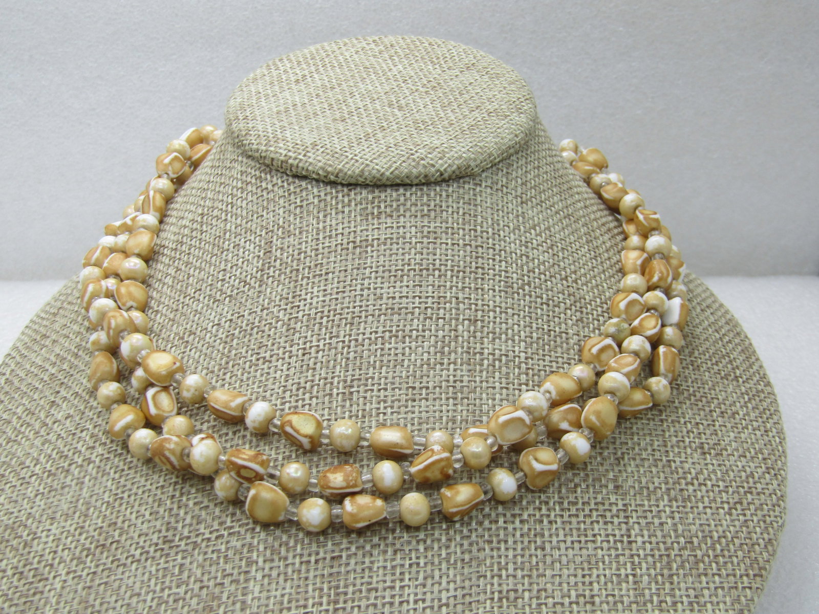 Vintage Triple Strand white/Gold Necklace, Nugget-like. 17", Japan: Vintage Triple Strand white/Gold Necklace, Nugget-like. 17", Japan . These are a white bead under neath, some round and some nuggets with a gold paint over tope and white showing through - not sure if