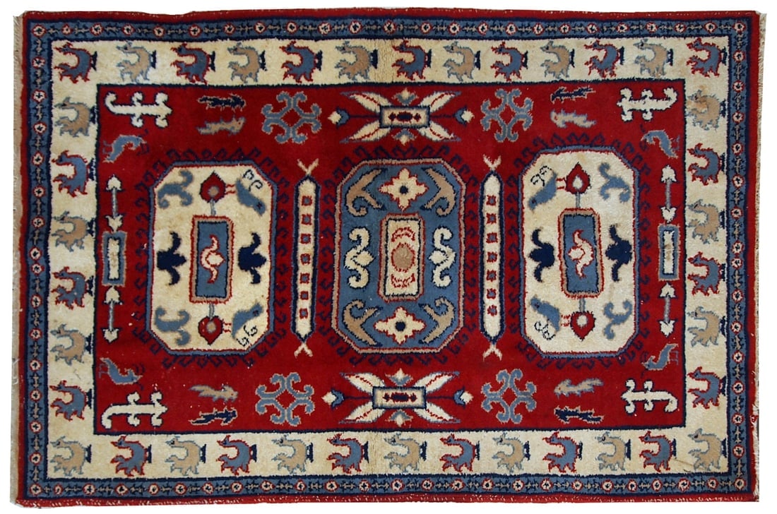 Handmade vintage Caucasian Kazak rug 4' x 6' (122cm x 185cm) 1970s: Title: Handmade vintage Caucasian Kazak rug 4' x 6' (122cm x 185cm) 1970s Origin:Russia Dimensions: 4' x 6' (122cm x 185cm) Materials:wool Year:1970s Description:Handmade Russian vintage rug in deep r