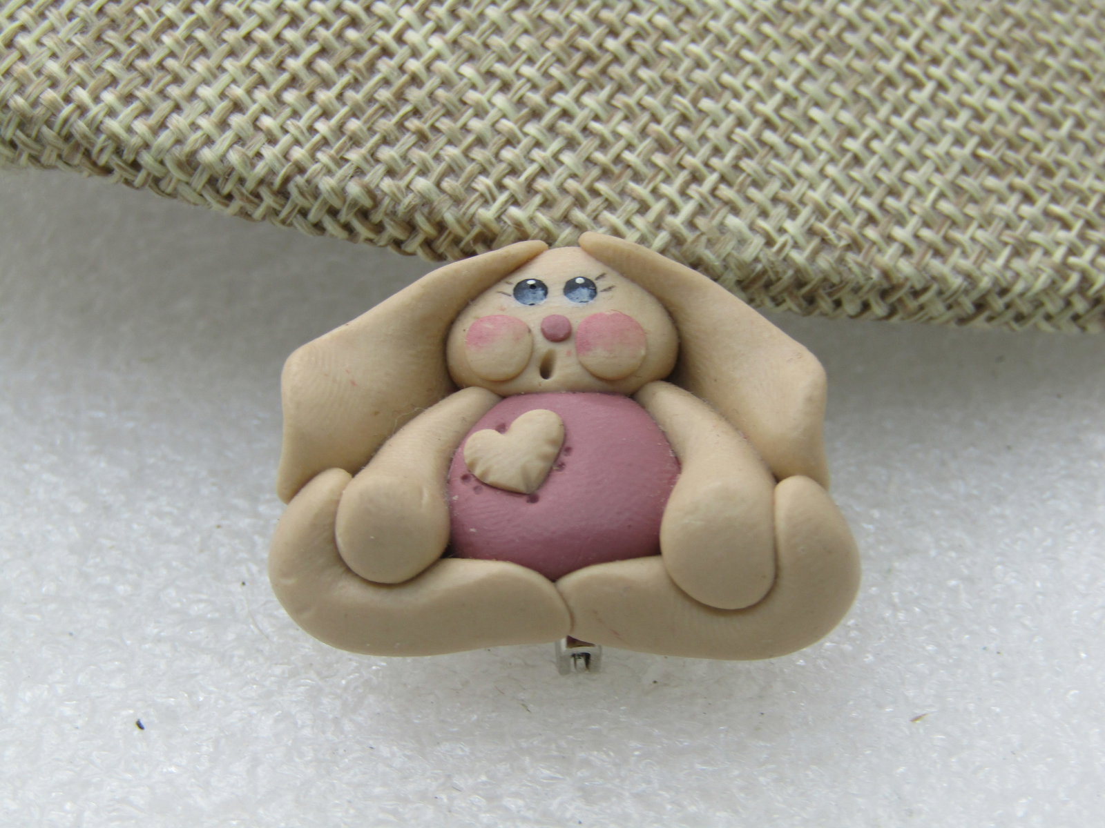 `Vintage Sculpted Rabbit & Heart Brooch, Handmade: Vintage Sculpted Rabbit & Heart Brooch, Handmade slightly over 1" wide and 1" tall. tan and pink. 1980's. Great for Easter too. (INV W.919204 SS2775 J LD 3/7/21). Reserve: $20.00 Shipping: Domestic: