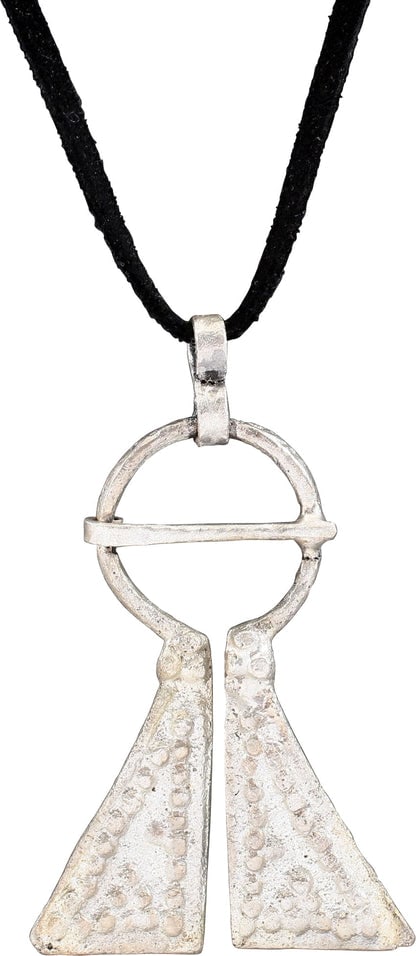 FINE VIKING PROTECTIVE BROOCH, C.950-1050 AD: Large example, over 2 1/8" height of omega form. Oval top with large triangular terminals with pellet triangles within roped borders and mirror image pellet arrangements, probably with supernatural ce