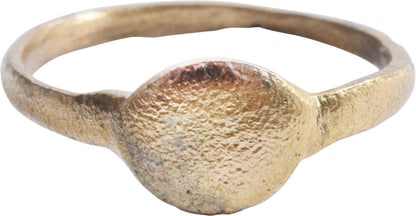 ROMAN WOMAN?S RING, 1st-3rd CENTURY AD, SIZE 5 3/4: Gilt bronze with raised circular bezel. Size 5 ¾ with 1.3mm rounded face band. Perhaps the ring of a prostitute as they wore very similar, but slightly more gaudy rings advertising their trade.