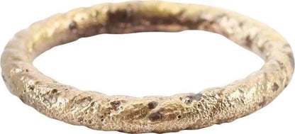 FINE VIKING TWISTED RING, 9TH CENTURY AD, SIZE 9: Wearable size 9. The band, 2.8mm thick, with twisted or roped motif its full circumference which is rare. It also is modeled in the full round with roping to the inside, now showing wear from use. The