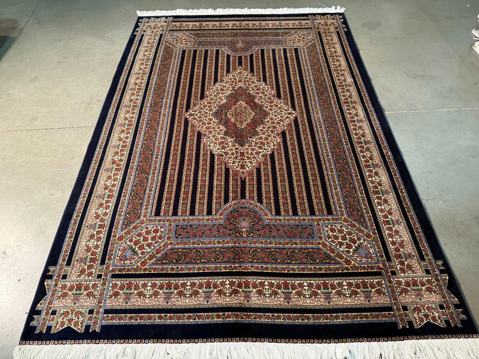 Fine Luxury Silk Rug 4.9x7.6: Title:Fine Luxury Silk Rug 4.9x7.6 Description:4.9x7.6 Fine Luxury Bamboo silk pile rug in Dark Navy gold colors Very Fine weave , Machine Made in Turkey Reserve: $950.00 Shipping: Domestic: Flat-rate