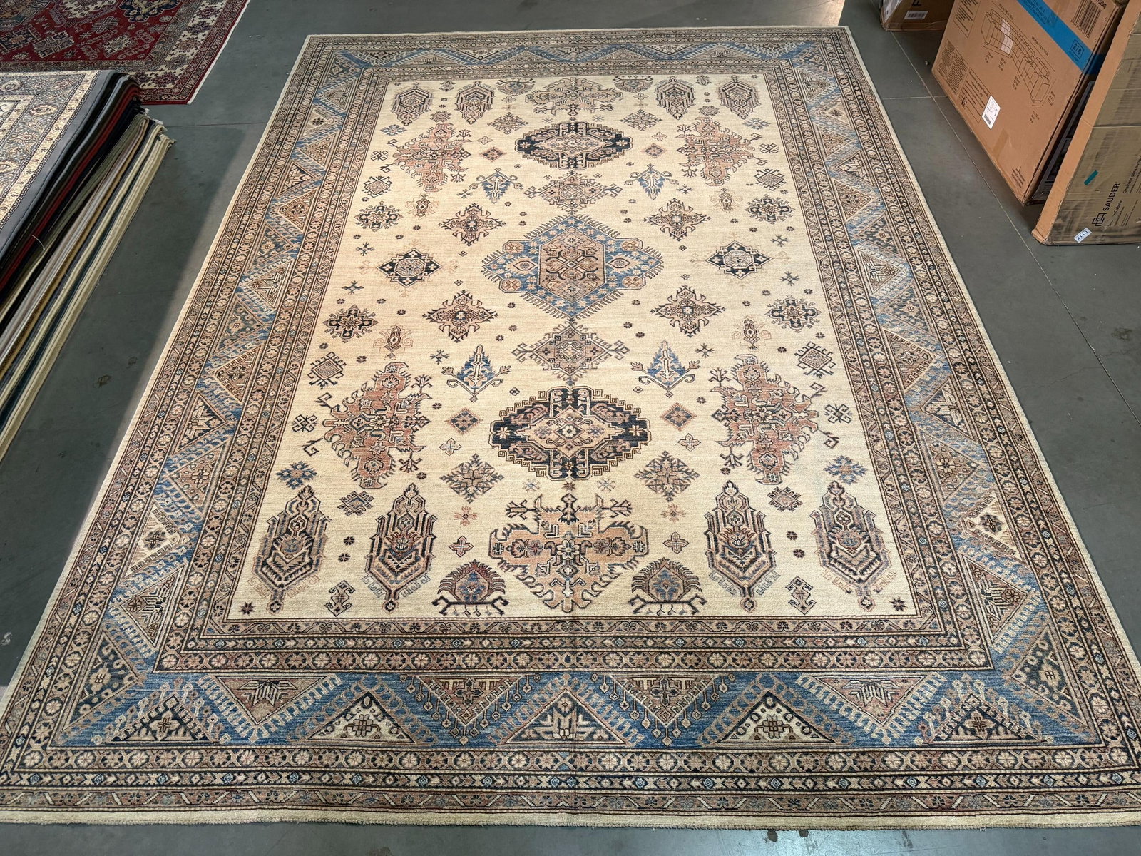 Fine Super Kazak Rug 10x13.5: Title:Fine Super Kazak Rug 10x13.5 Description:10' X13'.5" Super quality Kazak Rug, hand spun and hand knotted rug in Pakistan 100% Vegge Dye natural wool pile , in Ivory and different shades of Blue 