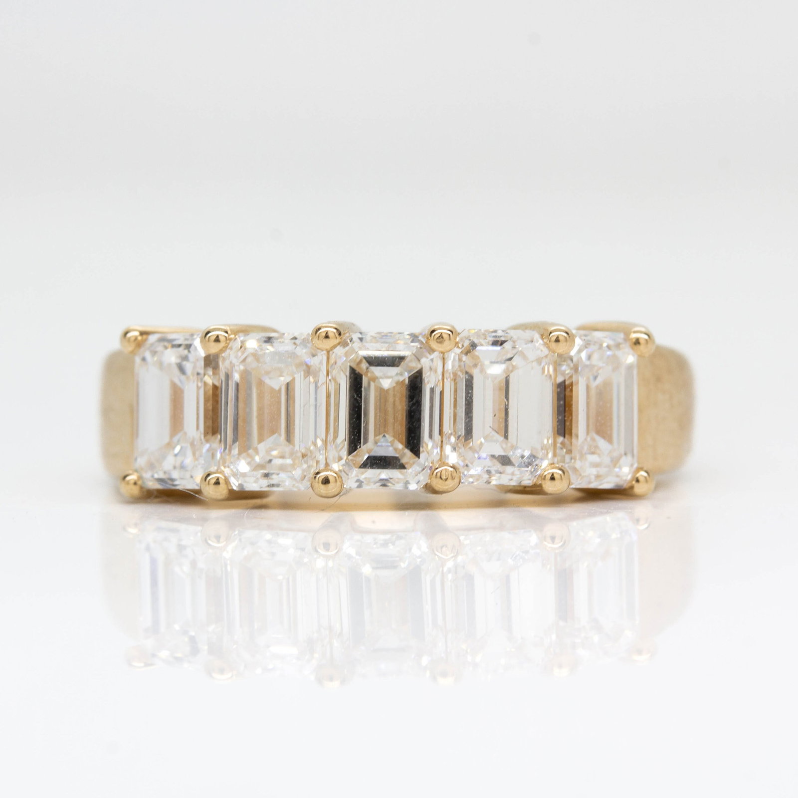ZENNITH RING: Title: ZENNITH RING Description: Made in 18k Rose Gold 5 Emerald Cut Natural Diamonds D-VVS1 2,50 ctw (0,50 ct each Diamond) Ring Size: 7 1/2 Total Weight: 5,5 grams/ 3,56 dwt Ring Measurement: 0.6mm