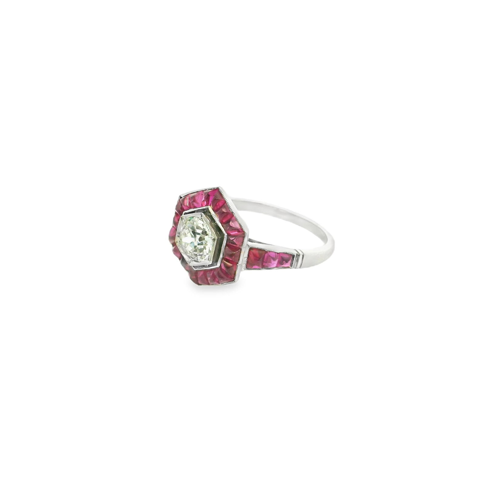Platinum Old European Cut Diamond and Natural Ruby Ring: Title: Platinum Old European Cut Diamond and Natural Ruby Ring Description: This stunning ring features a captivating design with a central old European cut diamond of I color and VS2 clarity that