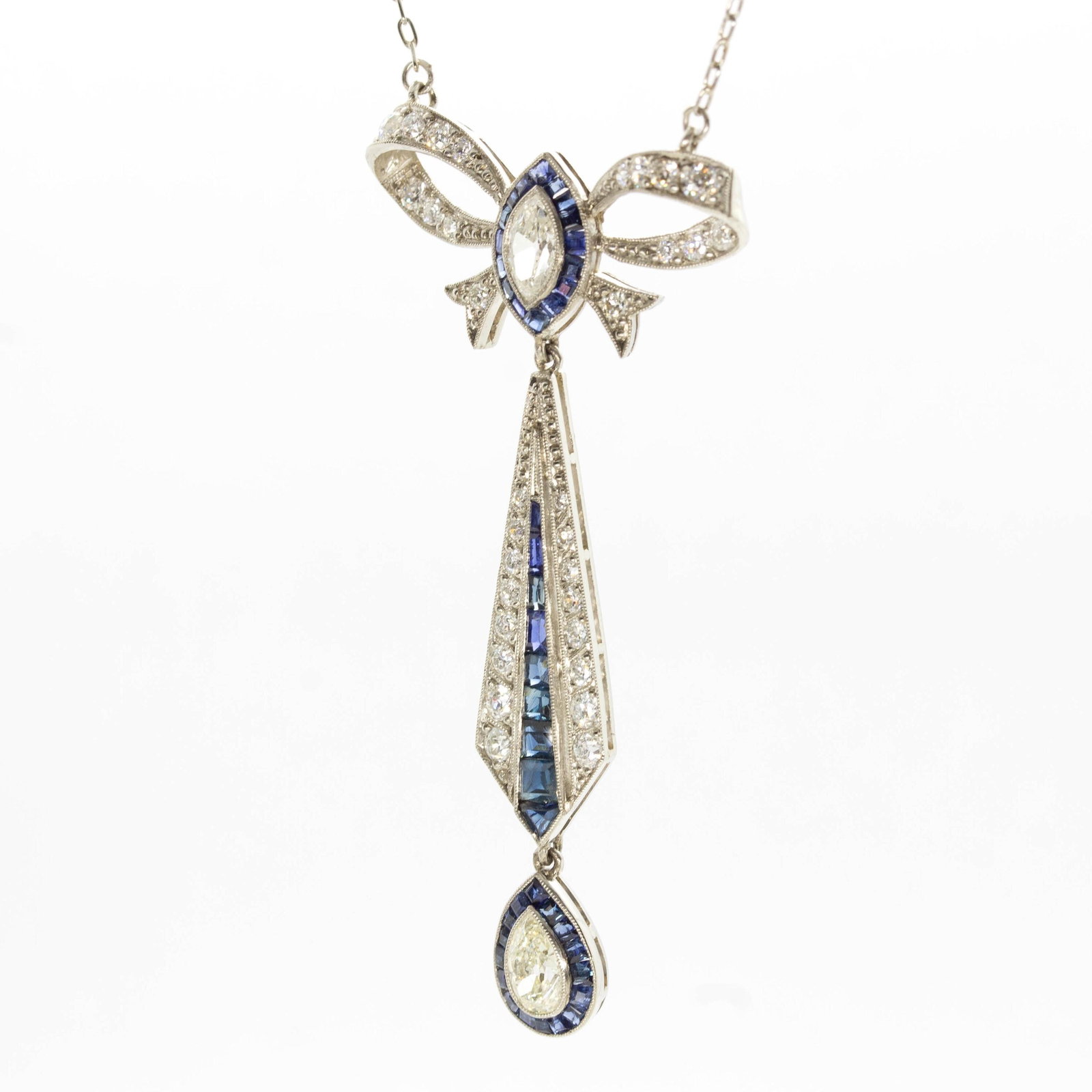 Art Deco Platinum French Cut Sapphire and Natural Diamond Pendant: Title: Art Deco Platinum French Cut Sapphire and Natural Diamond Pendant Description: The Anna pendant is an authentic vintage piece from the Art Deco circa 1920. It centers one natural drop cut old m