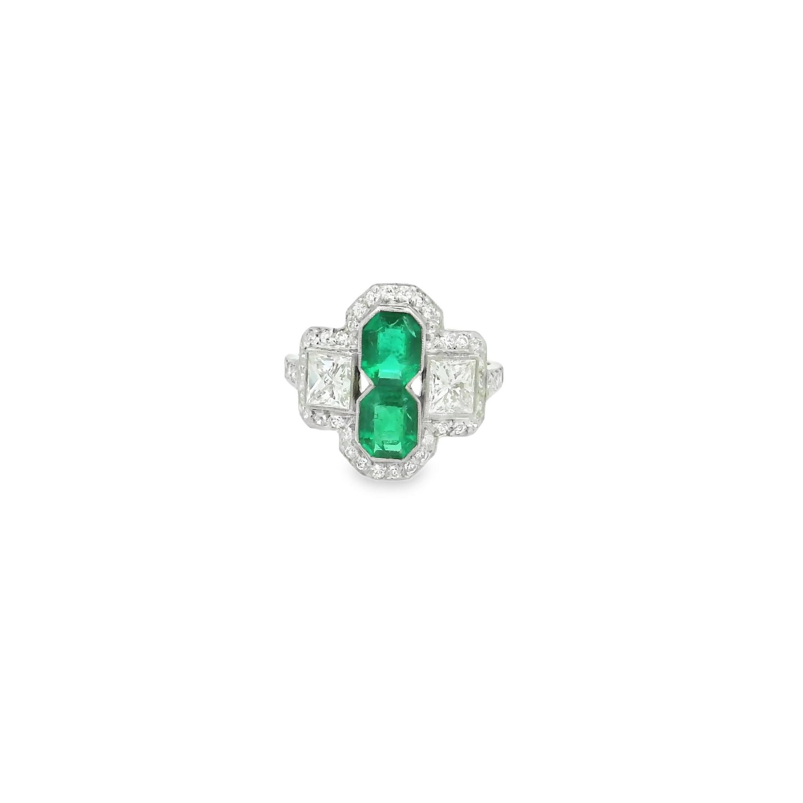 Platinum Natural Colombian Emerald and French cut Diamond Ring: Title: Platinum Natural Colombian Emerald and French cut Diamond Ring Description: Discover the timeless beauty of this elegant emerald ring. Crafted with intricate detailing, it features 2 stunning C