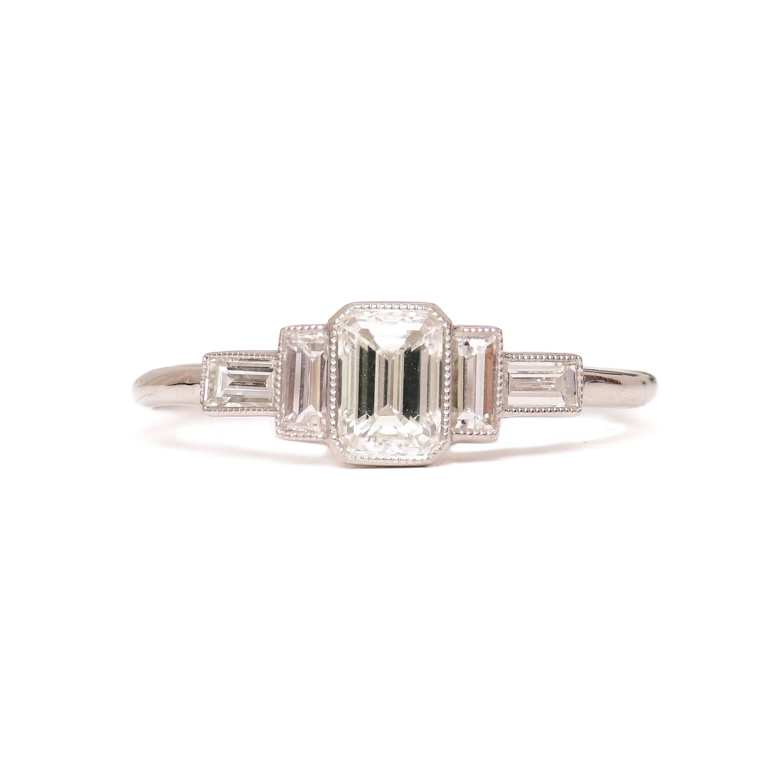 ANNAR RING: Title: ANNAR RING Description: Size: 7 1/2 US Materials: Platinum Adjustable Made in Platinum • 1 Emerald Cut Diamond D-VS1 0.52ctw • 4 Baguette Cut Diamonds D-VS1 0.33ctw Total weight: