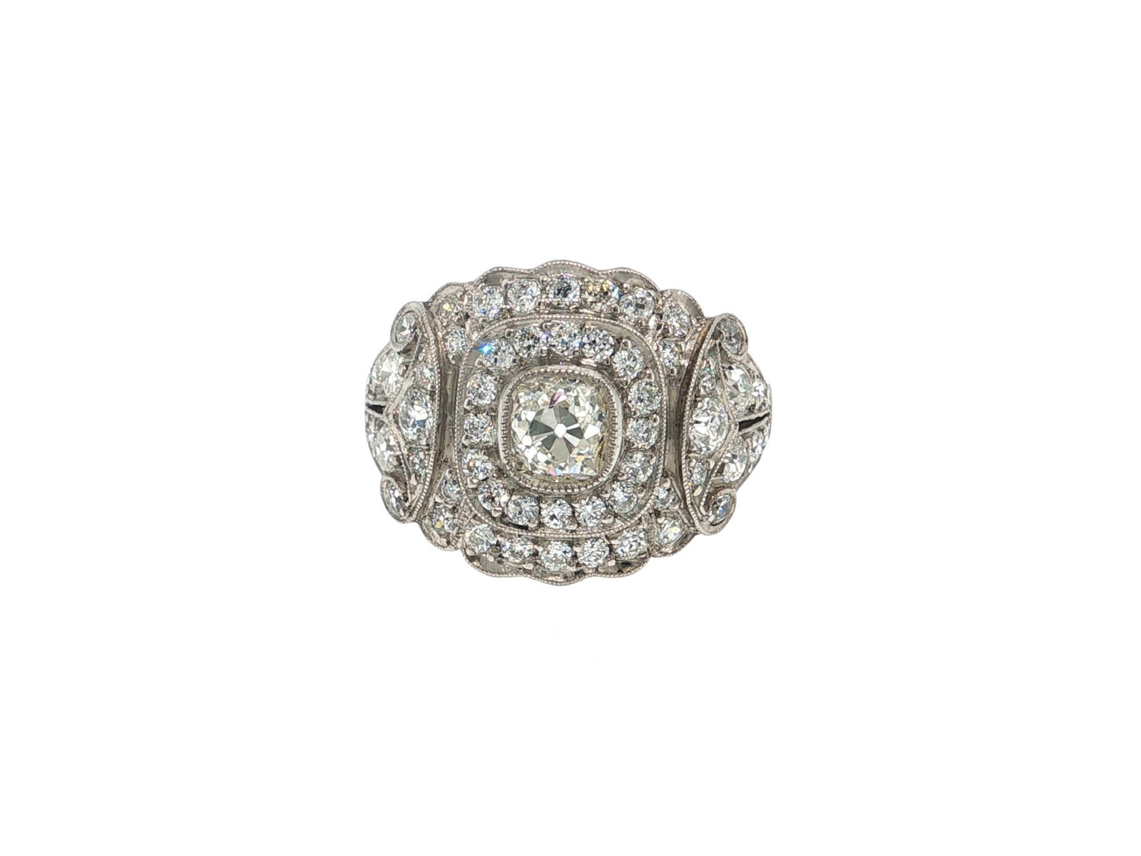 Antique Cushion Cut Diamond Double Halo Platinum Cocktail Ring: Title: Antique Cushion Cut Diamond Double Halo Platinum Cocktail Ring Description: An exquisite platinum cocktail ring featuring an antique cushion cut diamond center of I color and VS2 clarity that