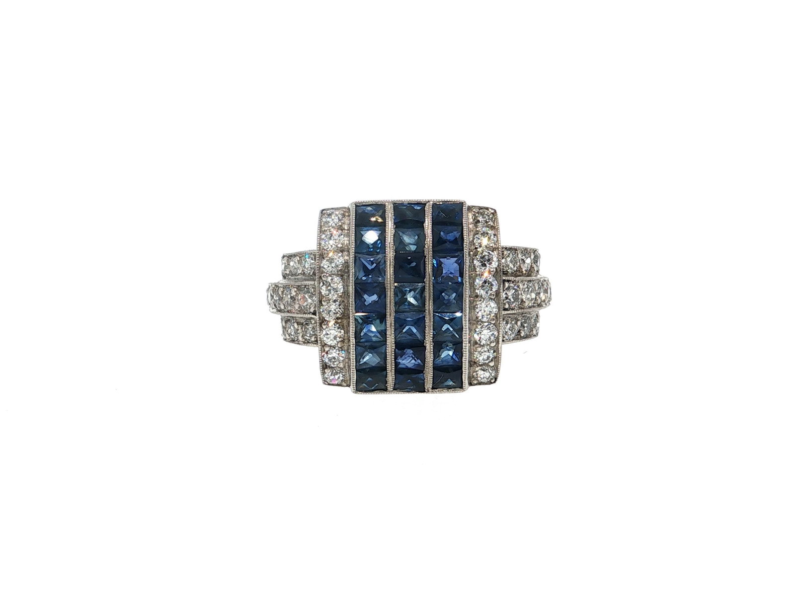 Art Deco Style Blue Sapphire and Diamond Platinum Cocktail Ring: Title: Art Deco Style Blue Sapphire and Diamond Platinum Cocktail Ring Description: An Art Deco style cocktail ring featuring three vertical rows of 21 natural French cut sapphires that weigh 3ctw.