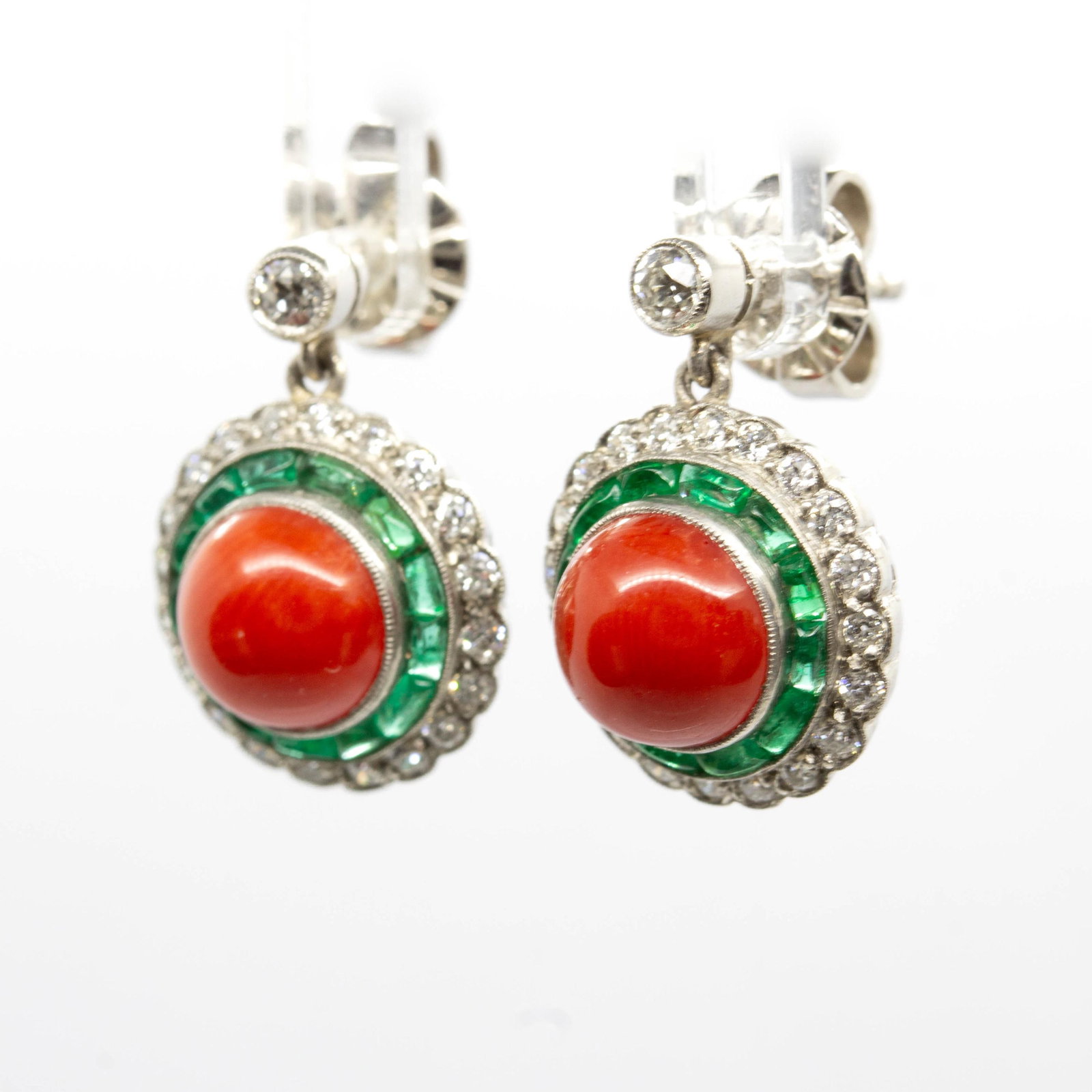 Art Deco Natural Coral, Emerald, and Diamond Earrings: Title: Art Deco Natural Coral, Emerald, and Diamond Earrings Description: The Annika earrings are an authentic vintage piece from the Art Deco era Circa 1920. They center 2 natural red corals and