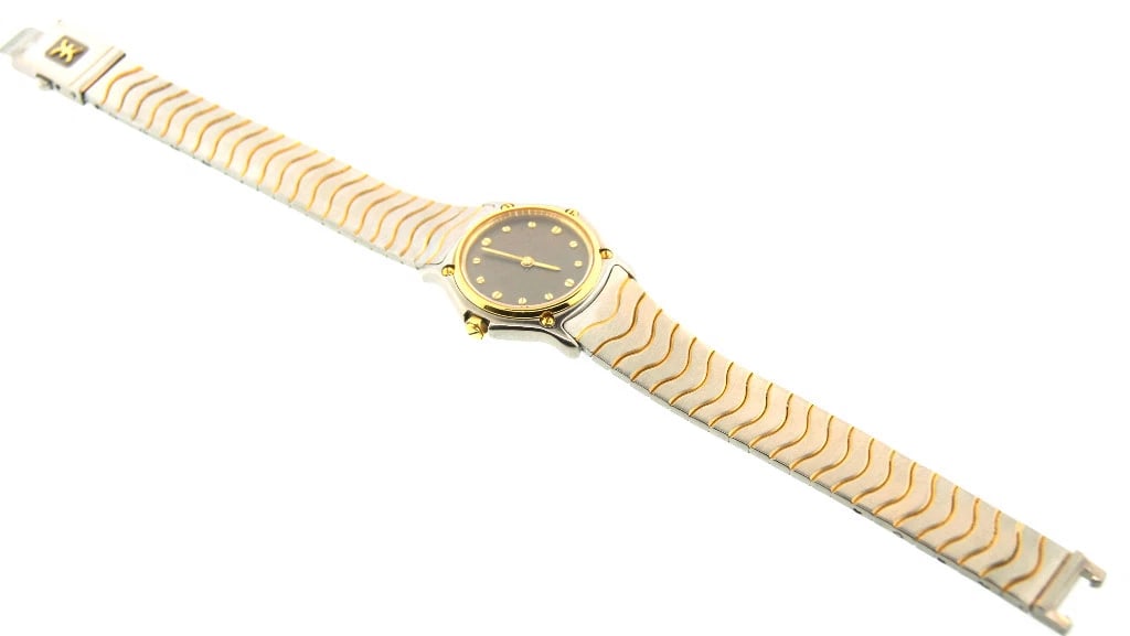 Stainless Steel & 18k Watch W/Quatz Movement By Ebel, circa 1980s: Title: Stainless Steel & 18k Watch W/Quatz Movement By Ebel, circa 1980s Description: Stainless Steel & 18k Yellow Gold Watch by Ebel, Circa 1980, Swiss Movement This watch, by Ebel features a Swiss