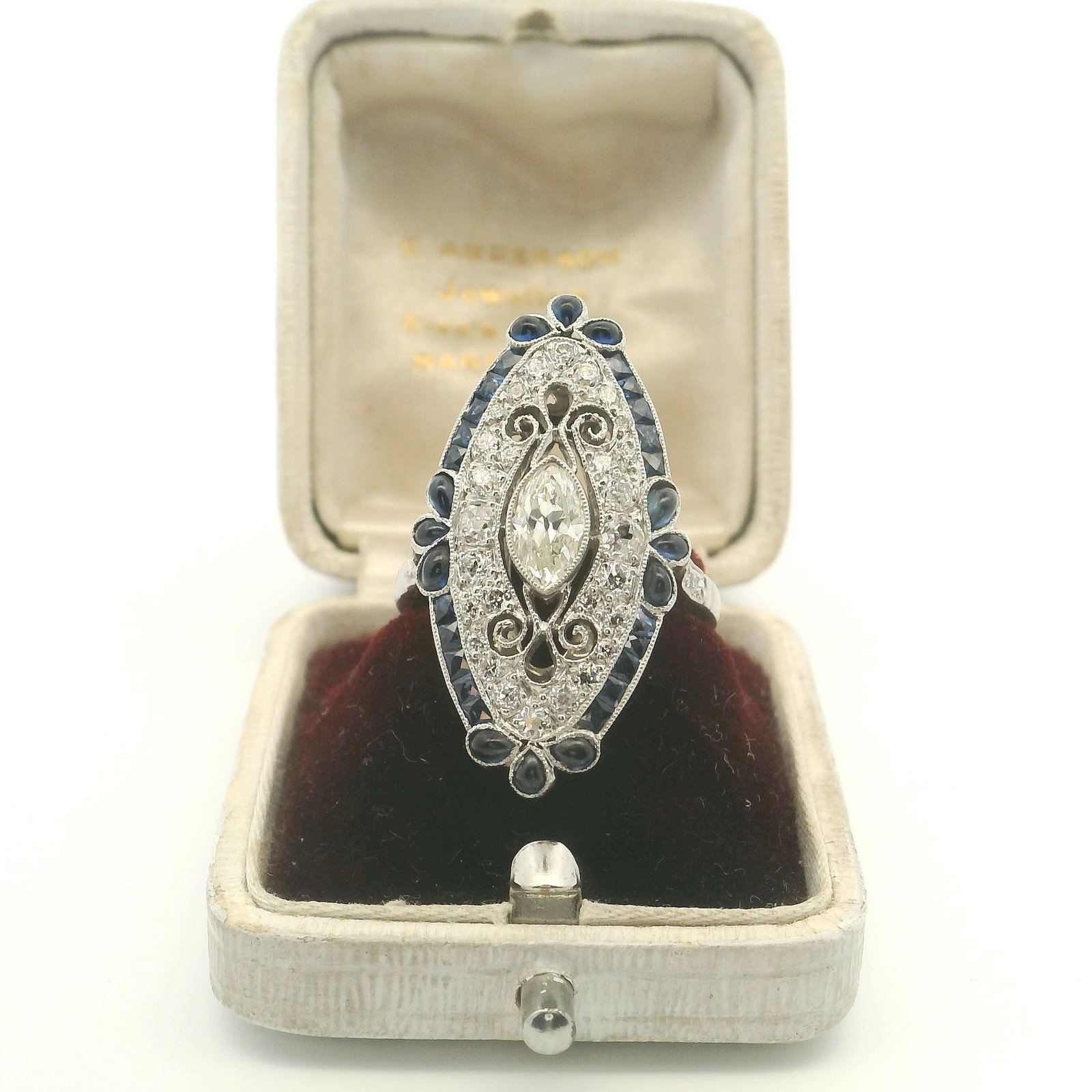 Platinum Engagement Ring with Natural Old Mine Cut Diamonds and Natural Sapphires: Title: Platinum Engagement Ring with Natural Old Mine Cut Diamonds and Natural Sapphires Description: This stunning ring features a captivating design with intricate detailing and sparkling gemstones.