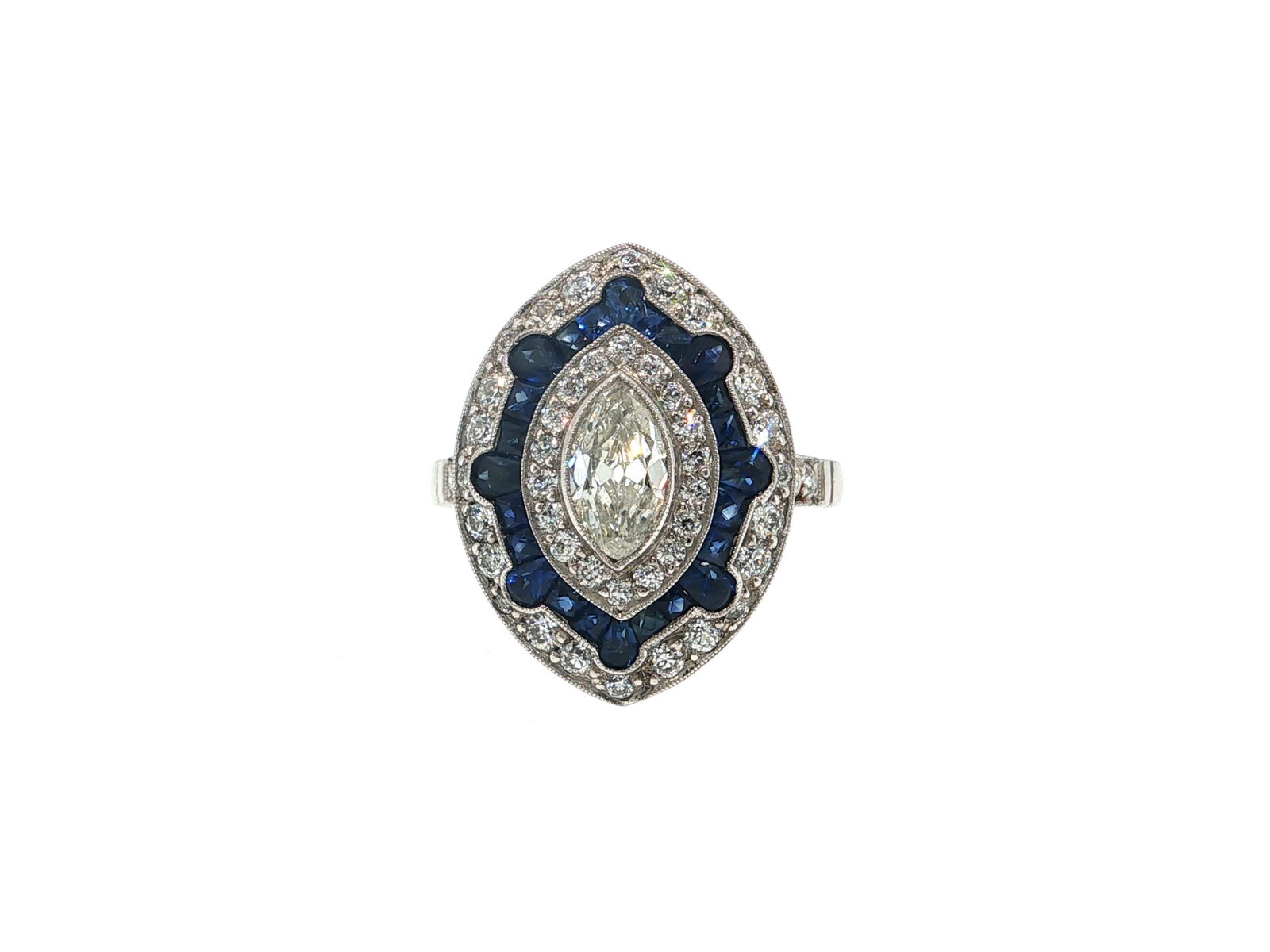 Marquise Diamond and Blue Sapphire Platinum Cocktail Ring: Title: Marquise Diamond and Blue Sapphire Platinum Cocktail Ring Description: An Art Deco inspired cocktail ring featuring an antique open cullet mine cut marquise diamond of H color and VS1 clarity