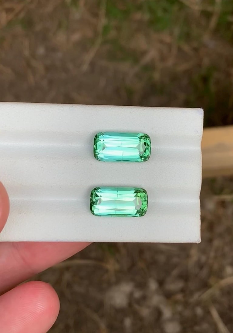 Rare seafoam Tourmaline Gemstone pair for jewellery: Fancy Cushion Cut Afghani Tourmaline (9.90cts): Carat weight: 9.90 presenting Natural Rare super glowing seafoam bluish green tourmaline Gemstone matching pair for jewellery Weight : 9.90 carats Dimensions : 14, 7, 5.9mm Shape : fancy cushion cut C