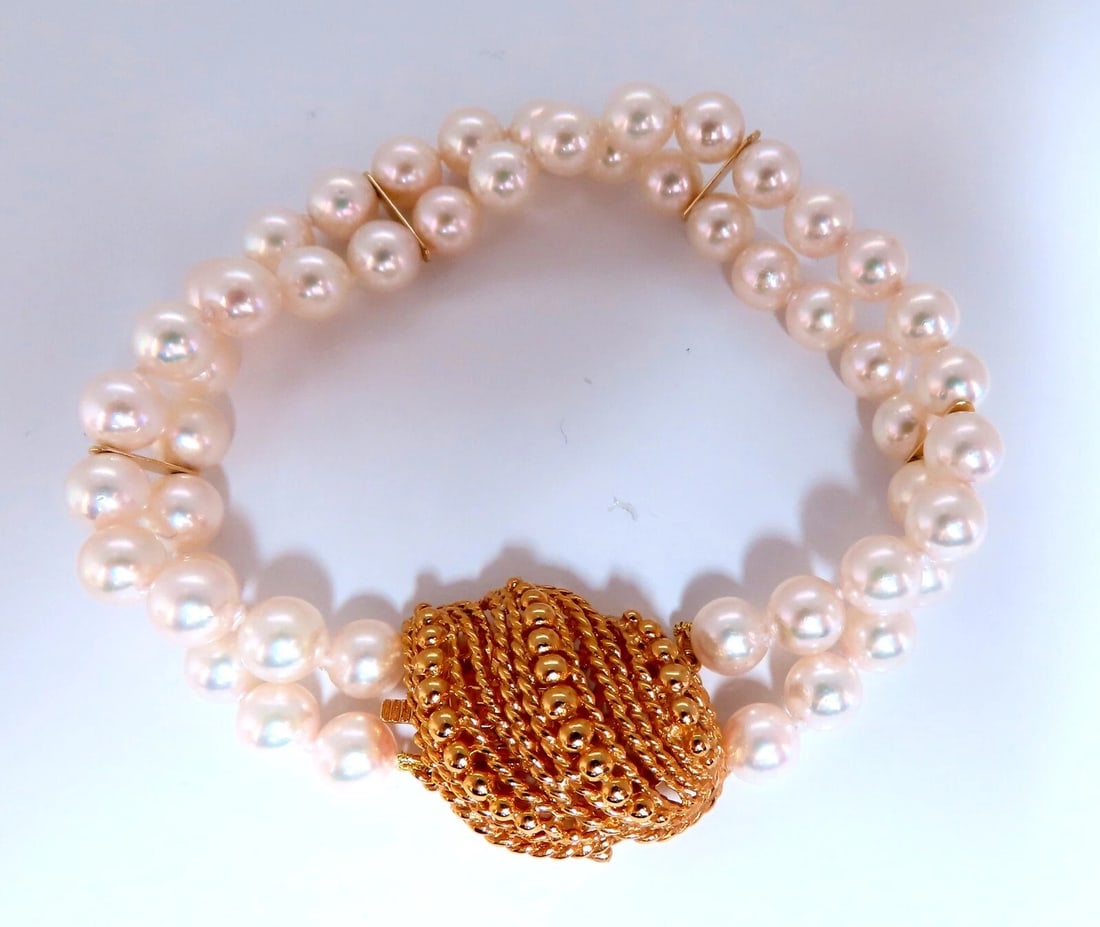 6.75mm Akoya pearls pearls double stranded bracelet 14kt Shell Twist Clasp**: Title: 6.75mm Akoya pearls pearls double stranded bracelet 14kt Shell Twist Clasp** Description: 6.7 mm Akoya pearls bracelet. Double stranded and bar linked. 14 karat yellow gold 8 in Long