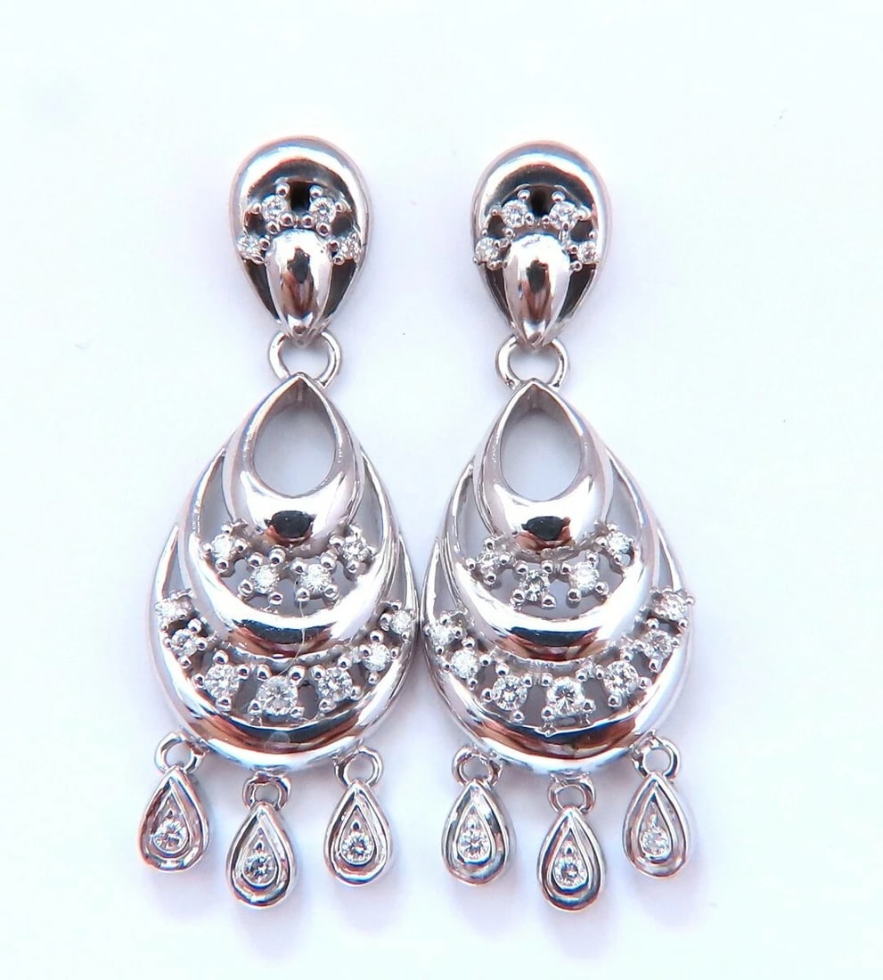 .60 carat natural diamond semi crescent dangle earrings 14kt**: Title: .60 carat natural diamond semi crescent dangle earrings 14kt** Description: Semi crescent dangle loop earrings. .60cts of natural round diamonds: H-color, Vs-2 clarity. 14kt. white gold 10 gram