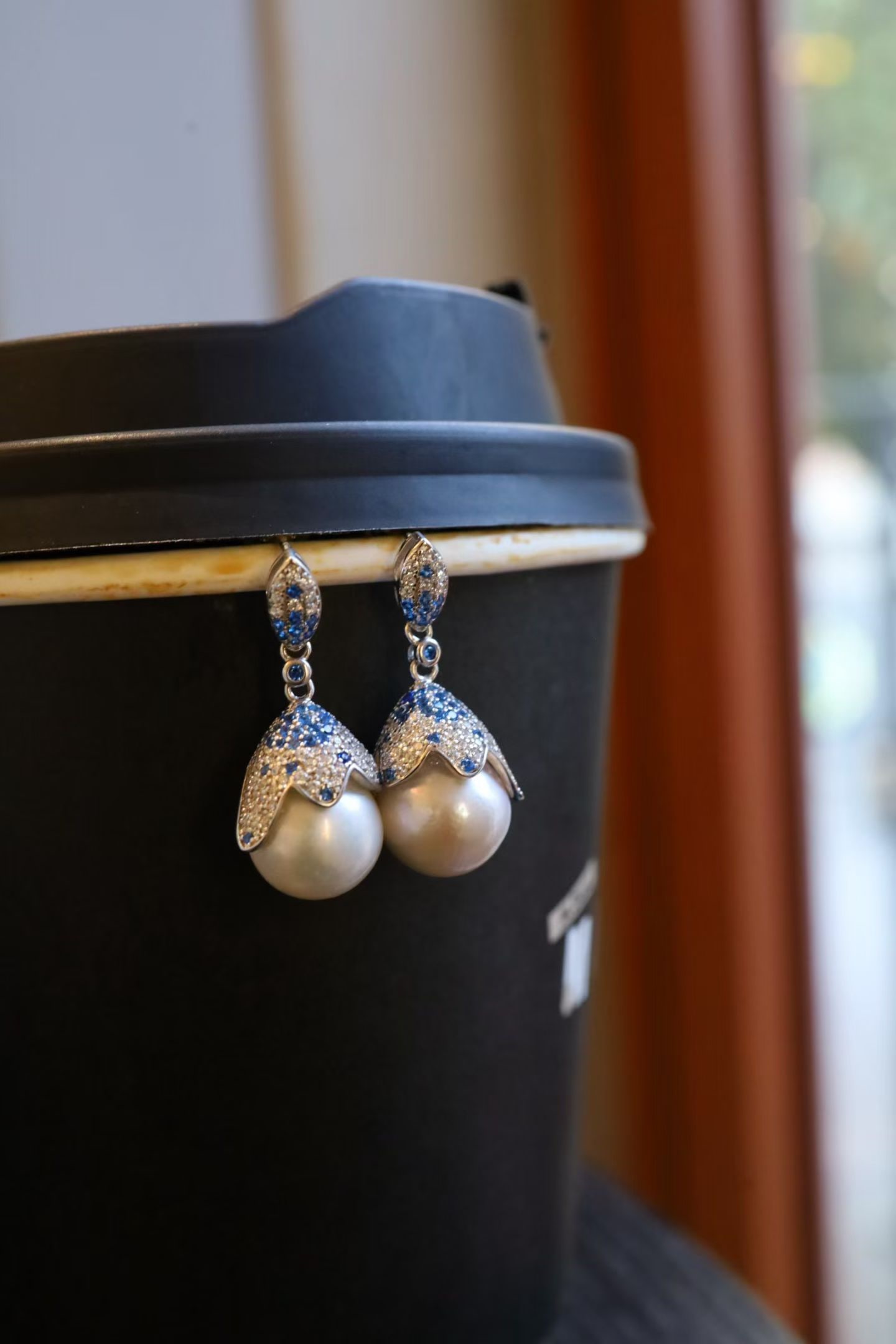 Sterling Silver Natural Pearl Earrings: Title: Sterling Silver Natural Pearl Earrings Description: These earrings are crafted from sterling silver and feature natural pearls, showcasing exquisite craftsmanship. The full Zircon design adds