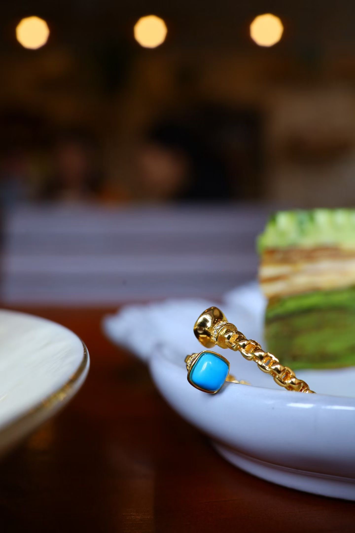 Sterling Silver Enhanced Turquoise Ring: Title: Sterling Silver Enhanced Turquoise Ring Description: This ring features a hand-woven square rope pattern, creating a three-dimensional effect under light. The main stone is enhanced turquoise,