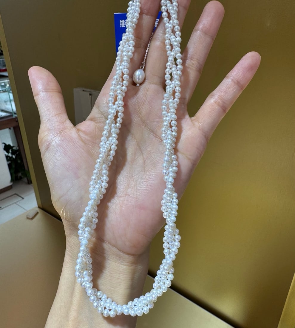 Strong Luster Freshwater Pearl Necklace: Title: Strong Luster Freshwater Pearl Necklace Description: This necklace features a classic braided design, adorned with 3-4mm round strong luster freshwater pearls, showcasing a flawless smooth surf